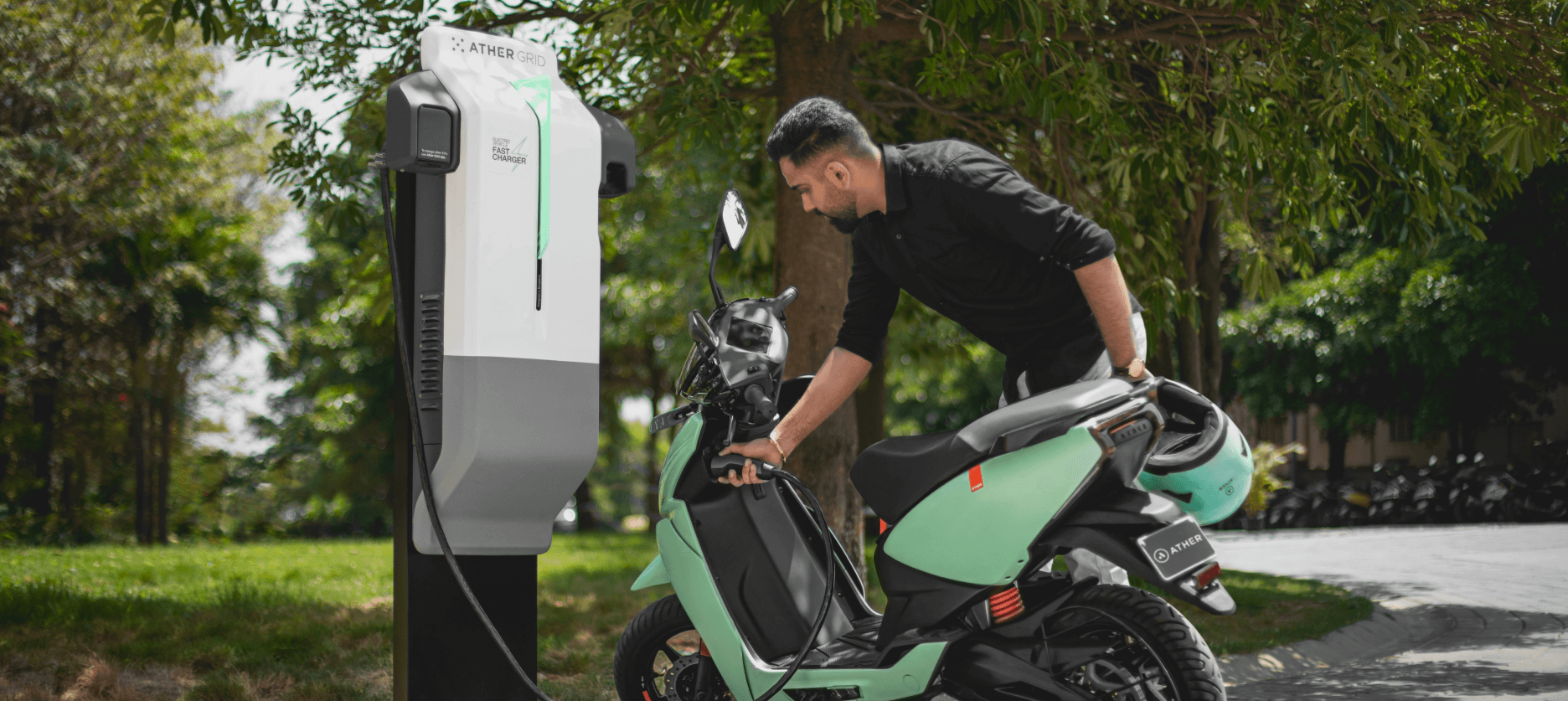 Fast charge your Ather 450X at any of the Ather Grid public charging points in your city. Find one on the Ather app or on the dashboard. Going on a long ride? Carry a portable charger along.<br> <b>2,700+ chargers in 230+ cities<br> Charging speed up to 15 km /10 min</b>